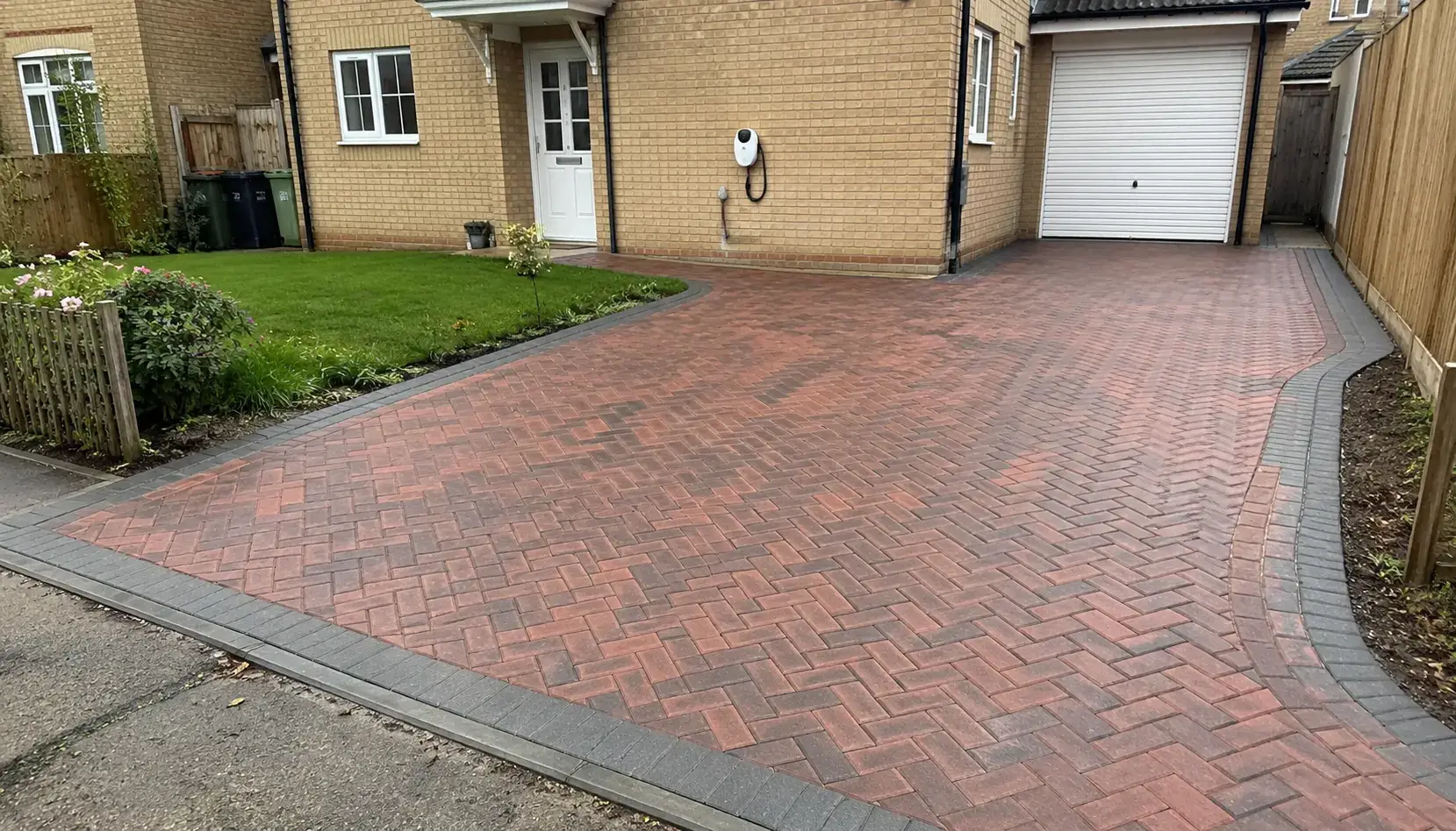Large finished block paving driveway outside a residential property near Cambridge.