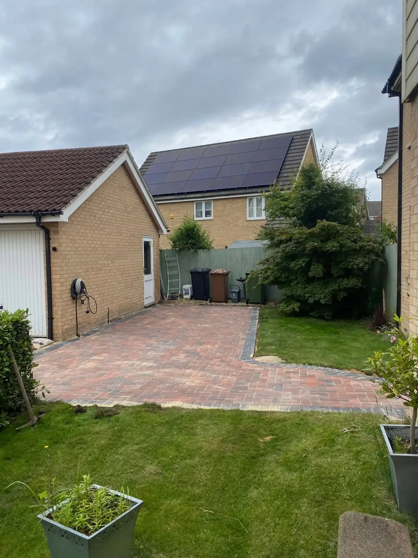 Finished herringbone block paving driveways in Ely with charcoal edging at a house in Ely.